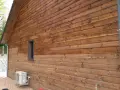 Bardage en bois Douglas traité, aspect chaleureux. Avis sur le saturateur bois Douglas : protection et esthétique réussies.