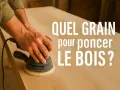 Main ponceuse orbitale sur une table en bois. La question "Quel grain pour poncer le bois ?" s'affiche en blanc.